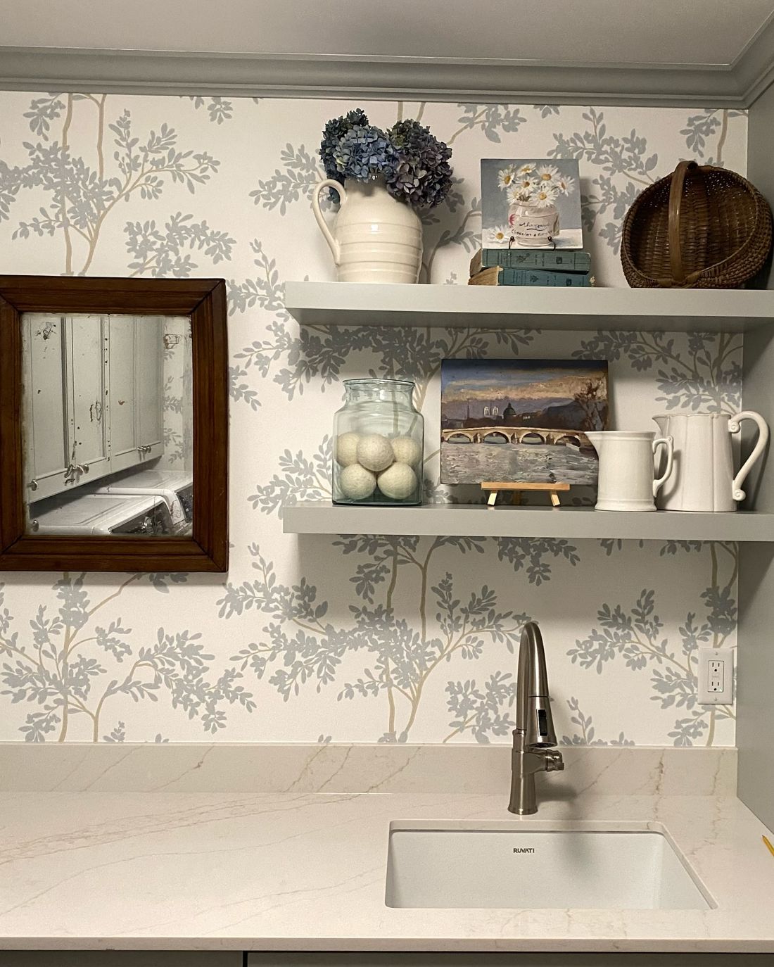 Wallpapered wall with floating shelves