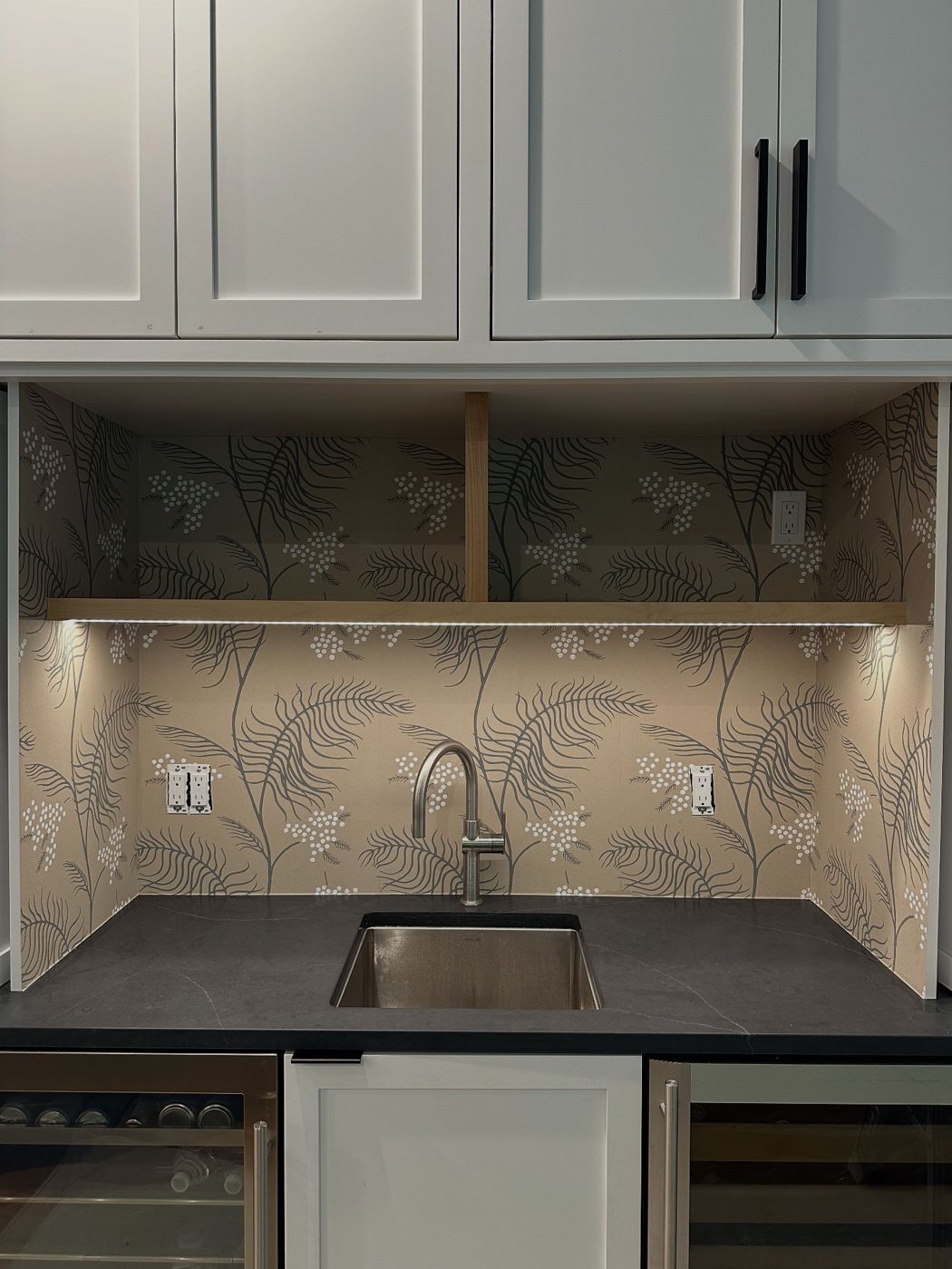 Built-in bar nook with fern wallpaper
