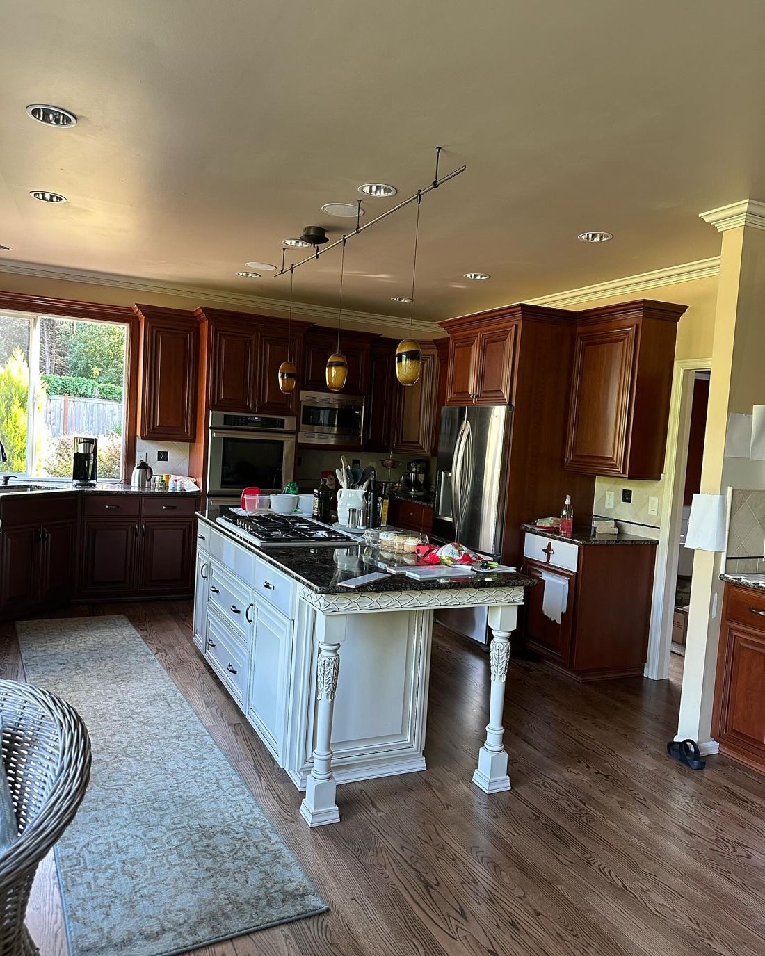 Kitchen before: cherry wood cabinets