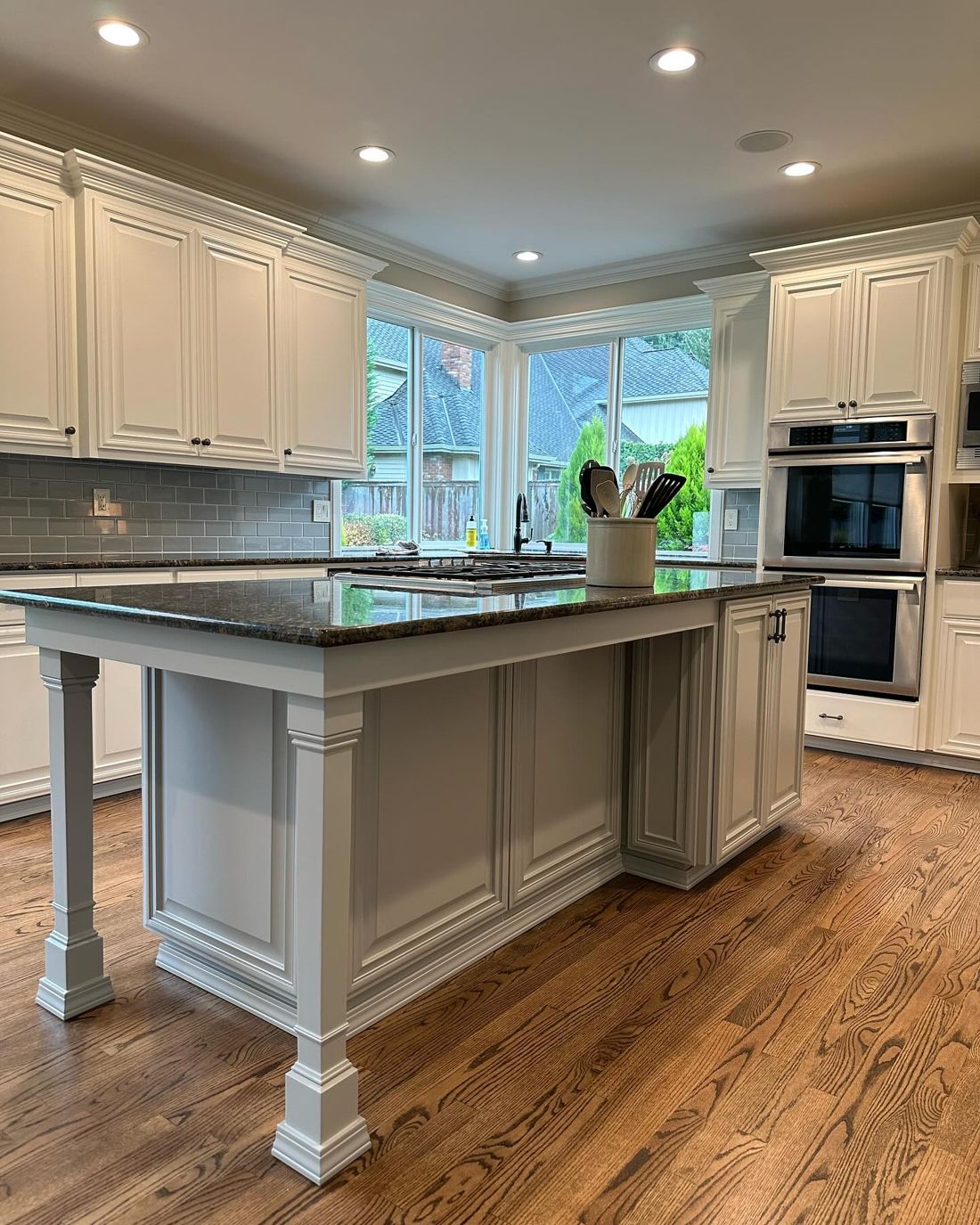 Kitchen cabinets and island painted white