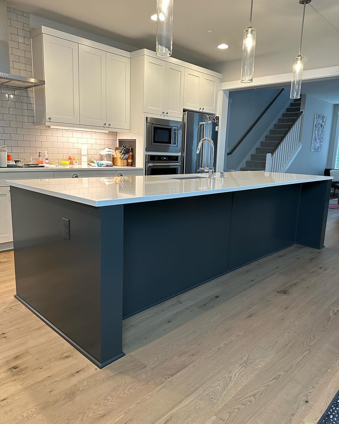 Large kitchen island painted deep navy