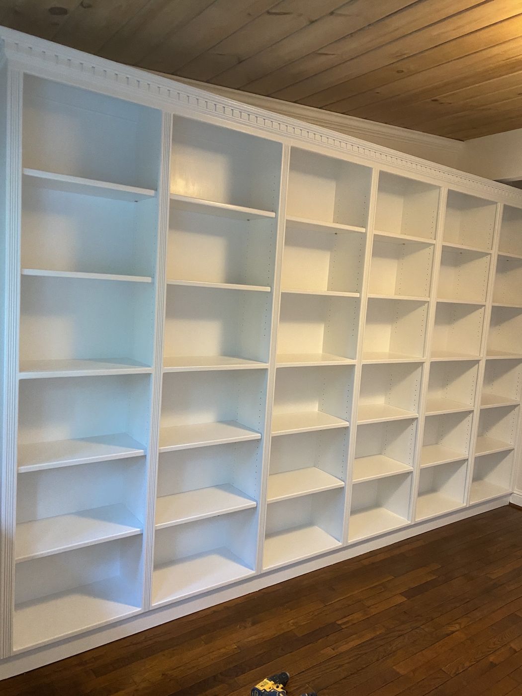White-painted built-in shelving wall